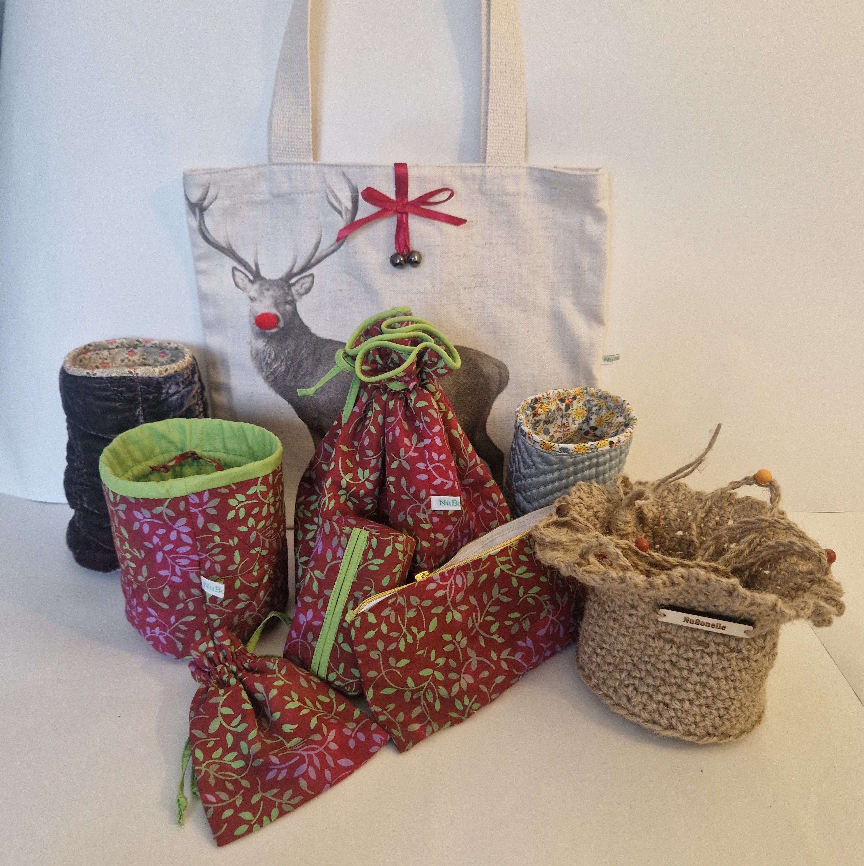 Collection of fabric bags and containers on a white surface